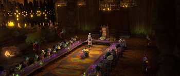 Movie still from “Trolls” (2016), directed by Mike Mitchell – A group of people sitting in a room; Wide shot, High angle