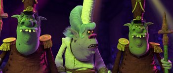 Movie still from “Trolls” (2016), directed by Mike Mitchell – A green troll with a white hat on his head; Medium shot, Over the shoulder angle