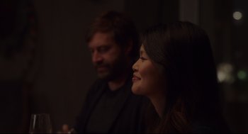 Movie still from “Tully” (2018), directed by Jason Reitman – A man and a woman sitting next to each other in the dark; Close Up shot, Over the shoulder angle