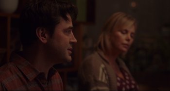 Movie still from “Tully” (2018), directed by Jason Reitman – A man and a woman sitting next to each other in a room; Close Up shot, Over the shoulder angle