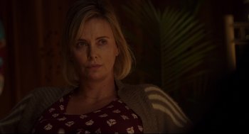 Movie still from “Tully” (2018), directed by Jason Reitman – A woman with blonde hair wearing a red and white dress; Close Up shot, Over the shoulder angle