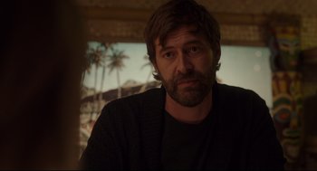 Movie still from “Tully” (2018), directed by Jason Reitman – A person with a beard; Close Up shot, Over the shoulder angle