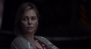 Movie still from “Tully” (2018), directed by Jason Reitman – A person sitting in a chair; Close Up shot, Over the shoulder angle