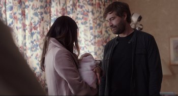 Movie still from “Tully” (2018), directed by Jason Reitman – A man and a woman standing next to each other; Medium shot, Over the shoulder angle
