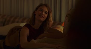 Movie still from “Tully” (2018), directed by Jason Reitman – A woman sitting on top of a bed looking up at the sky; Close Up shot, Over the shoulder angle