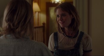 Movie still from “Tully” (2018), directed by Jason Reitman – A woman in a white t - shirt is talking to another woman; Close Up shot, Over the shoulder angle