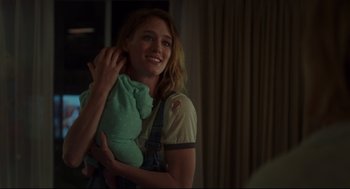 Movie still from “Tully” (2018), directed by Jason Reitman – A woman holding a stuffed animal in her arms; Close Up shot, Over the shoulder angle