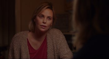Movie still from “Tully” (2018), directed by Jason Reitman – Charlize theron sitting in front of a mirror; Close Up shot, Over the shoulder angle