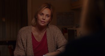 Movie still from “Tully” (2018), directed by Jason Reitman – Charlize theron sitting in a room; Close Up shot, Over the shoulder angle