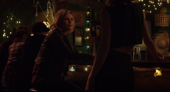 Movie still from “Tully” (2018), directed by Jason Reitman – A woman sitting at a table in front of a man; Medium shot, Over the shoulder angle