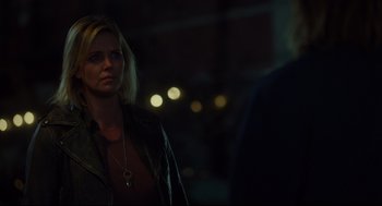 Movie still from “Tully” (2018), directed by Jason Reitman – A woman standing next to a man in a dark room; Close Up shot, Over the shoulder angle