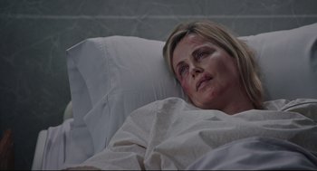 Movie still from “Tully” (2018), directed by Jason Reitman – A woman laying in a hospital bed looking up at the sky; Close Up shot, Over the shoulder angle