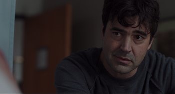 Movie still from “Tully” (2018), directed by Jason Reitman – A person sitting down with his eyes wide open; Close Up shot, Over the shoulder angle