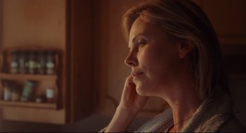 Movie still from “Tully” (2018), directed by Jason Reitman – A person sitting in front of a window; Close Up shot, Low angle