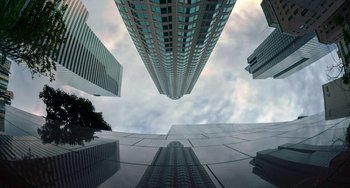 Movie still from “Velvet Buzzsaw” (2019), directed by Dan Gilroy – Looking up at a skyscraper in the sky; Extreme Wide shot, Low angle