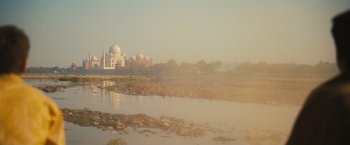 Movie still from “Slumdog Millionaire” (2008), directed by Danny Boyle – A view of the taj mahal from across the river; Extreme Wide shot, Low angle