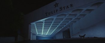 Movie still from “Slumdog Millionaire” (2008), directed by Danny Boyle – A building that has a star on the top of it; Extreme Wide shot, Low angle