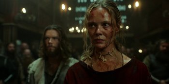 Movie still from “Vikings: Valhalla” (2022), created by Jeb Stuart – A woman with blood all over her face and neck; Close Up shot, Low angle