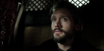 Movie still from “Vikings: Valhalla” (2022), created by Jeb Stuart – A person with a beard; Close Up shot, Over the shoulder angle