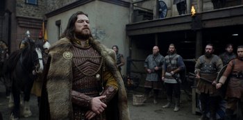 Movie still from “Vikings: Valhalla” (2022), created by Jeb Stuart – A group of men dressed in medieval clothing; Medium shot, Low angle