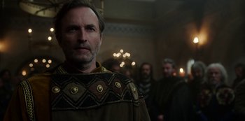 Movie still from “Vikings: Valhalla” (2022), created by Jeb Stuart – A person wearing a robe; Close Up shot, Over the shoulder angle