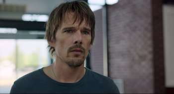 Movie still from “Before Midnight” (2013), directed by Richard Linklater – A person with a beard; Close Up shot, Over the shoulder angle