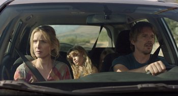 Movie still from “Before Midnight” (2013), directed by Richard Linklater – A group of people in the back of a car; Medium shot, Over the shoulder angle