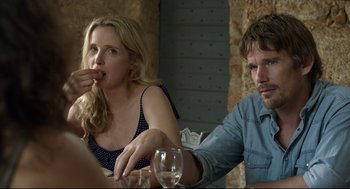 Movie still from “Before Midnight” (2013), directed by Richard Linklater – A woman and a man sitting at a dinner table; Close Up shot, Over the shoulder angle