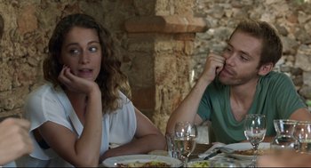 Movie still from “Before Midnight” (2013), directed by Richard Linklater – A man and a woman sitting at a dinner table; Close Up shot, Over the shoulder angle