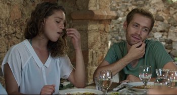 Movie still from “Before Midnight” (2013), directed by Richard Linklater – A man and a woman sitting at a dinner table; Close Up shot, Over the shoulder angle
