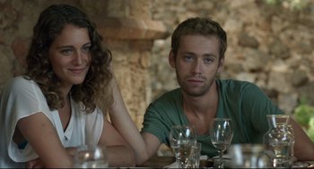 Movie still from “Before Midnight” (2013), directed by Richard Linklater – A man and a woman sitting at a dinner table; Close Up shot, Low angle