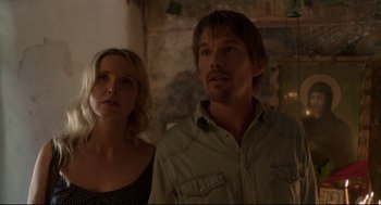 Movie still from “Before Midnight” (2013), directed by Richard Linklater – A man and a woman standing next to each other in a room; Close Up shot, Low angle