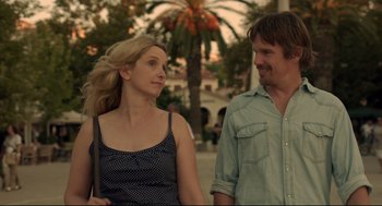 Movie still from “Before Midnight” (2013), directed by Richard Linklater – A man and a woman walking down a street; Medium shot, Over the shoulder angle