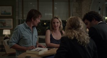Movie still from “Before Midnight” (2013), directed by Richard Linklater – A group of people sitting around a table; Medium shot, Over the shoulder angle