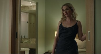 Movie still from “Before Midnight” (2013), directed by Richard Linklater – A woman standing in front of a bathroom sink; Medium shot, Over the shoulder angle