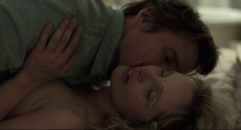 Movie still from “Before Midnight” (2013), directed by Richard Linklater – A man and a woman laying on the ground; Close Up shot, Overhead angle