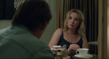Movie still from “Before Midnight” (2013), directed by Richard Linklater – A woman sitting in front of a man at a table; Close Up shot, Over the shoulder angle
