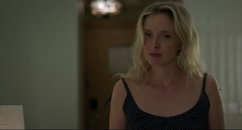 Movie still from “Before Midnight” (2013), directed by Richard Linklater – A woman with blonde hair wearing a polka dot top; Close Up shot, Over the shoulder angle