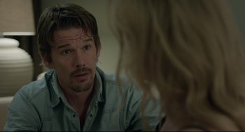 Movie still from “Before Midnight” (2013), directed by Richard Linklater – A man and a woman looking at one another in the mirror; Close Up shot, Over the shoulder angle