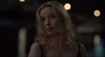 Movie still from “Before Midnight” (2013), directed by Richard Linklater – A woman with blonde hair is looking at the camera; Close Up shot, Over the shoulder angle
