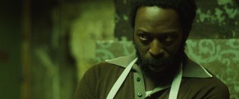 Movie still from “Small Axe” (2020), directed by Steve McQueen – A person with a beard; Close Up shot, Low angle