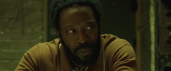 Movie still from “Small Axe” (2020), directed by Steve McQueen – A person wearing headphones; Close Up shot, Low angle