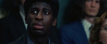 Movie still from “Small Axe” (2020), directed by Steve McQueen – A person looking up at something; Close Up shot, Low angle