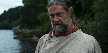 Movie still from “Vikings: Valhalla” (2022), created by Jeb Stuart – A man with a beard and a long grey beard; Close Up shot, Low angle