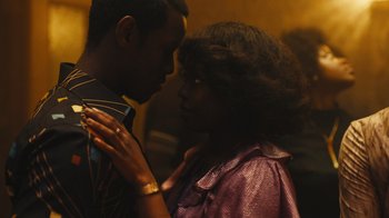 Movie still from “Small Axe” (2020), directed by Steve McQueen – A man and a woman standing next to each other; Close Up shot, Over the shoulder angle