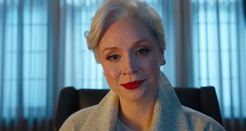 Movie still from “Wednesday” (2022), created by Miles Millar – A person with short white hair; Close Up shot, Low angle