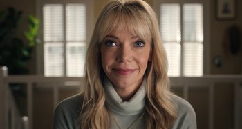 Movie still from “Wednesday” (2022), created by Miles Millar – A person with long hair; Close Up shot, High angle