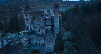 Movie still from “Wednesday” (2022), created by Miles Millar – Extreme Wide shot, High angle