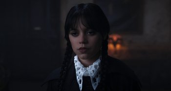 Movie still from “Wednesday” (2022), created by Miles Millar – Close Up shot, Over the shoulder angle