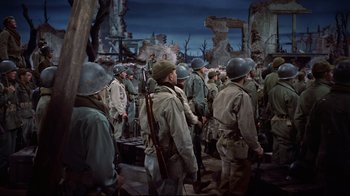 Movie still from “White Christmas” (1954), directed by Michael Curtiz – A group of men standing next to each other; Wide shot, High angle